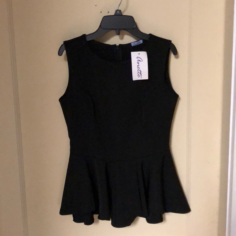 Black sleeveless peplum top